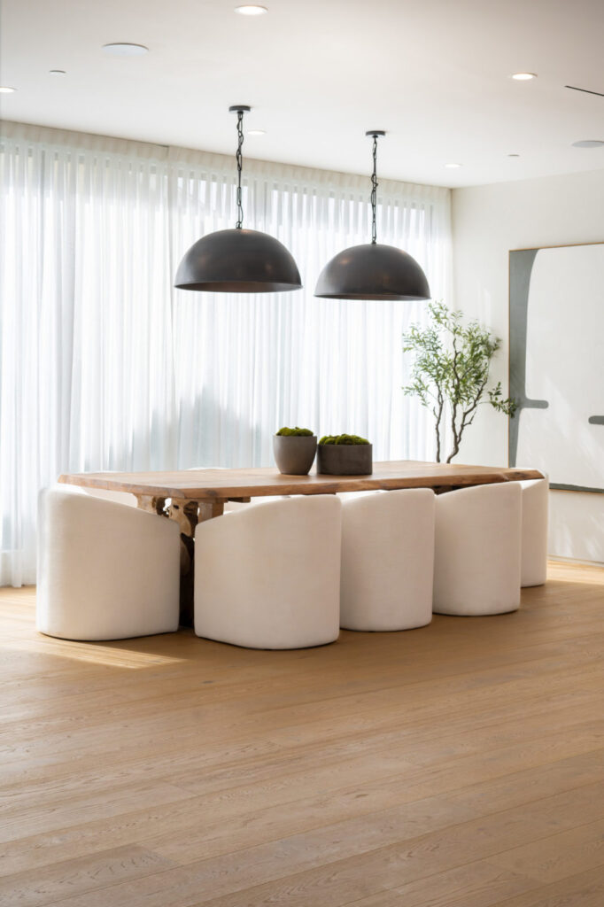 Light-colored luxury hardwood flooring in a modern California home, enhancing the open, sunlit space with its elegant grain and smooth finish.