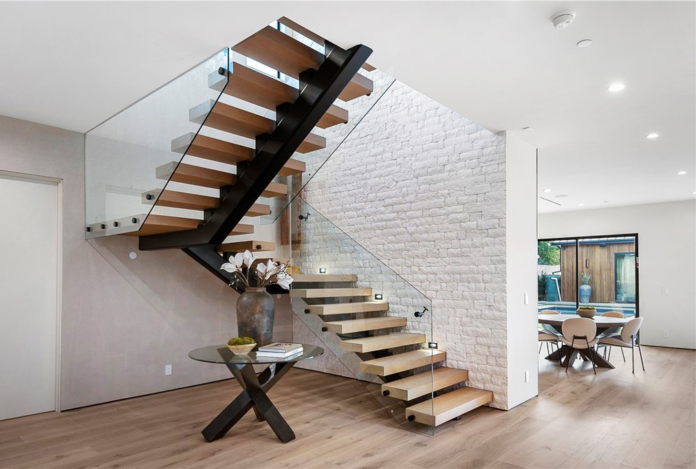 Light-colored luxury hardwood flooring in a modern California home, enhancing the open, sunlit space with its elegant grain and smooth finish.